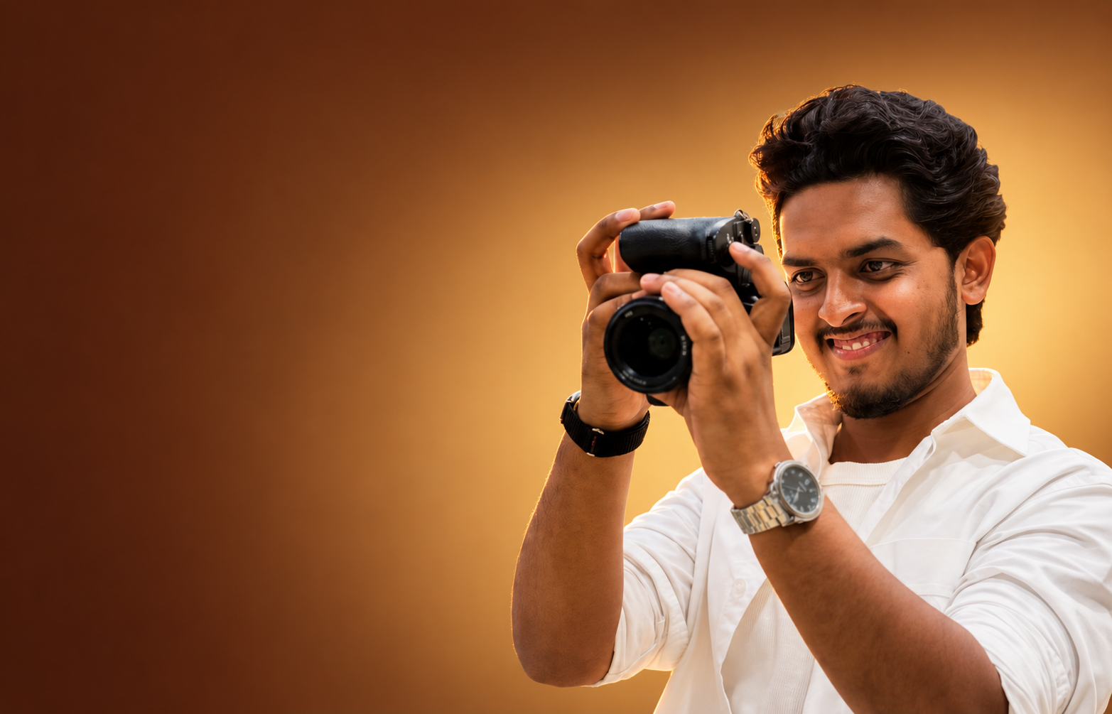 Pavan Visuals professional photographer in Hyderabad holding a camera